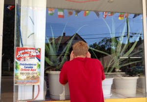 I peer into a dark, empty Costa Rican restaurant. A letter on the door explained that the restaurant is closed until July 13.